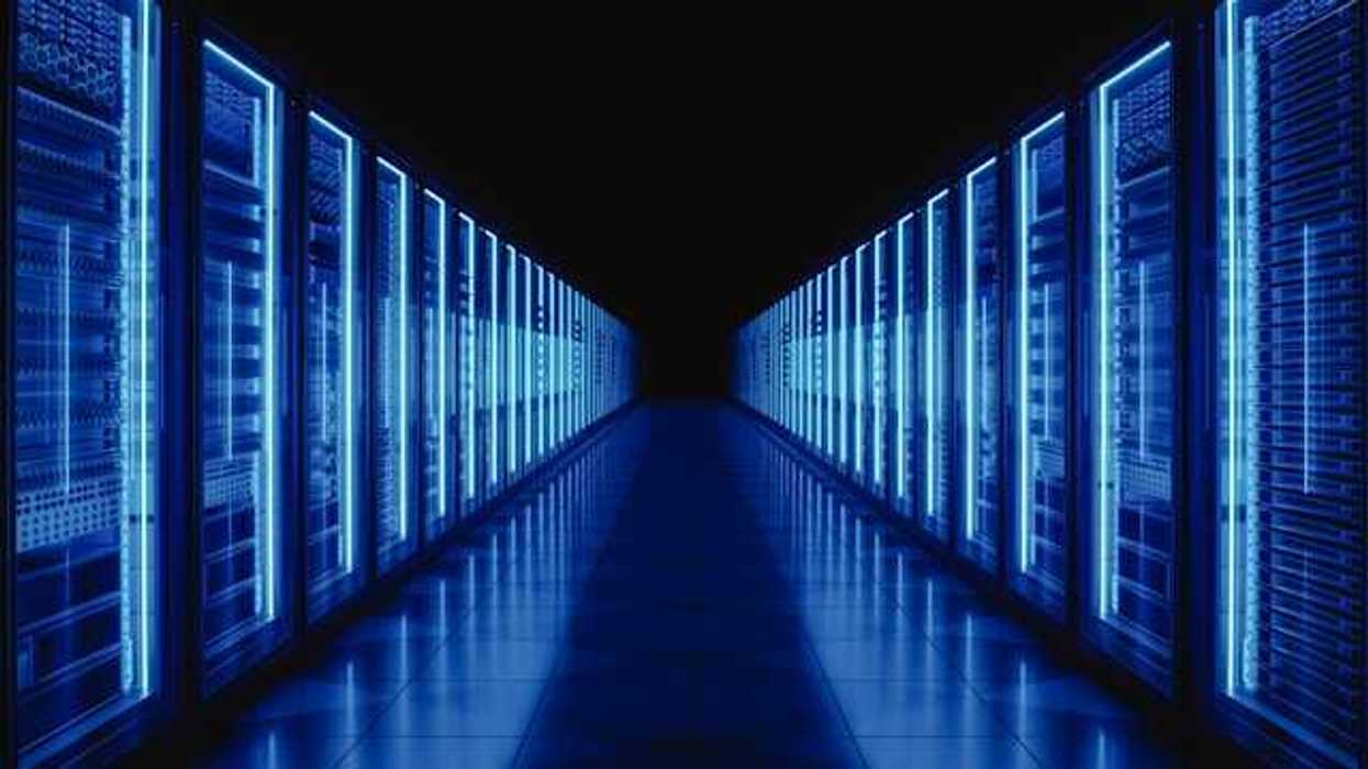 The interior of a data center with servers stretching into the distance