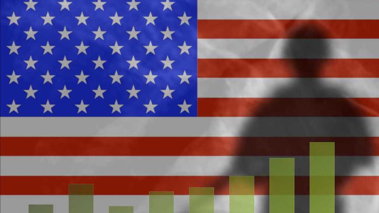 The shadow of a soldier on the background of the American flag. Graph depicts military spending growth chart.