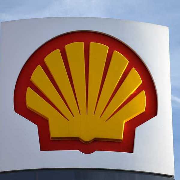 The Shell company's red and yellow logo against a blue sky