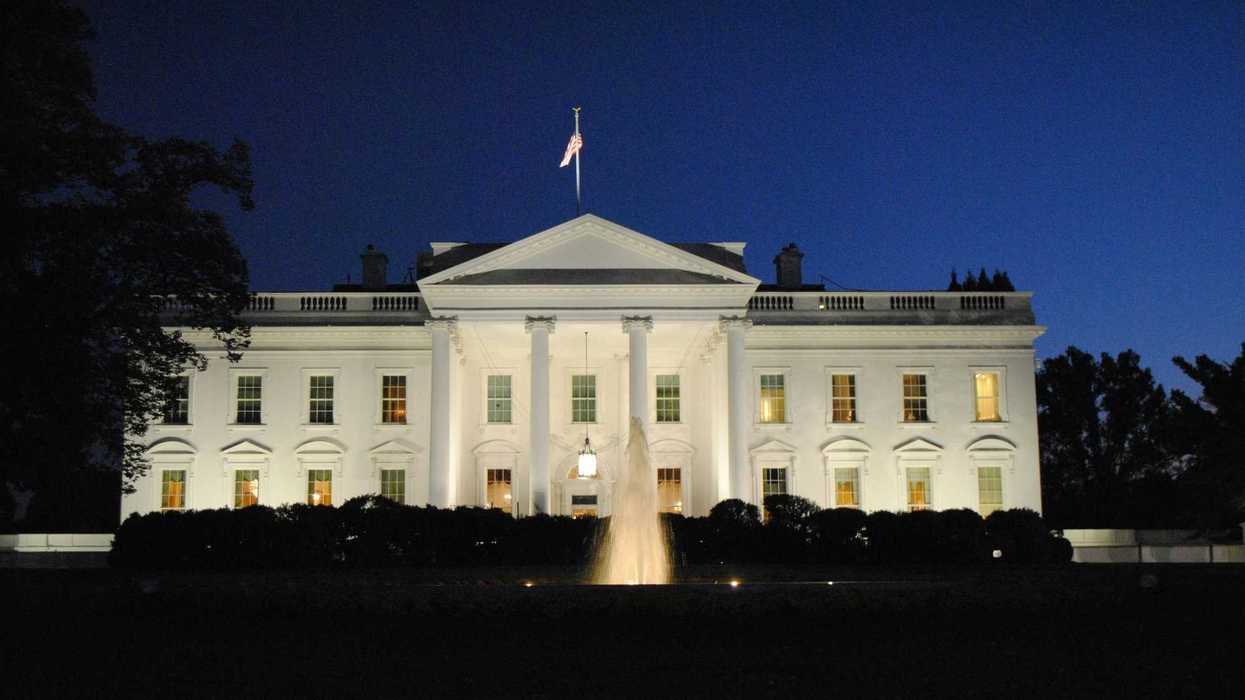 The White House illuminated at night.