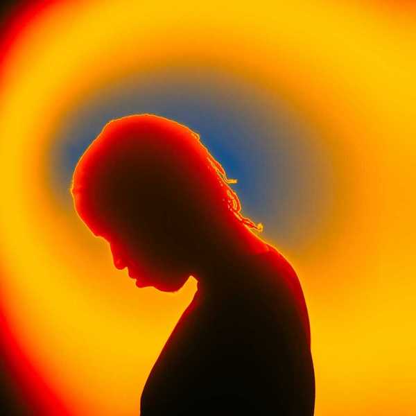 Thermal image of person with bowed head, presumably sad or afflicted with some malady