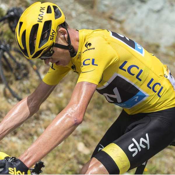 Tour de France rider laboring in yellow jersey