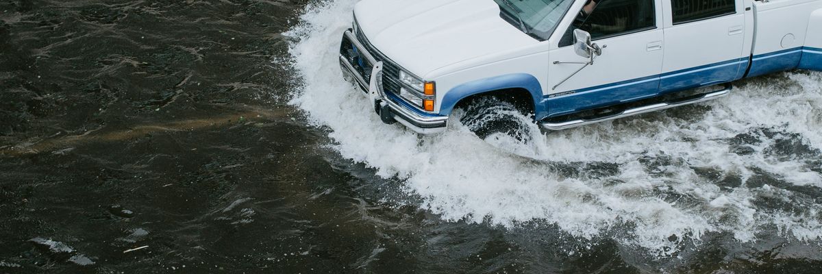 truck driving in a flood