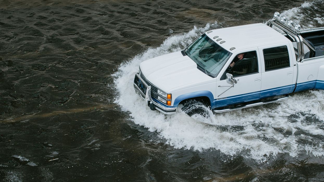 truck driving in a flood