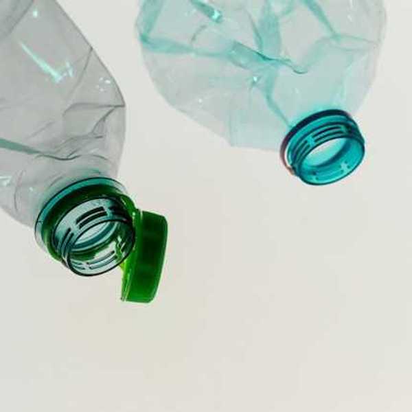 Two empty plastic bottles without the caps on