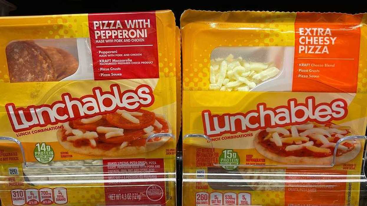 Two lunchables packages on a grocery store shelf