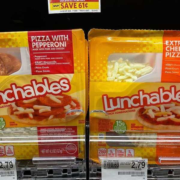 Two lunchables packages on a grocery store shelf