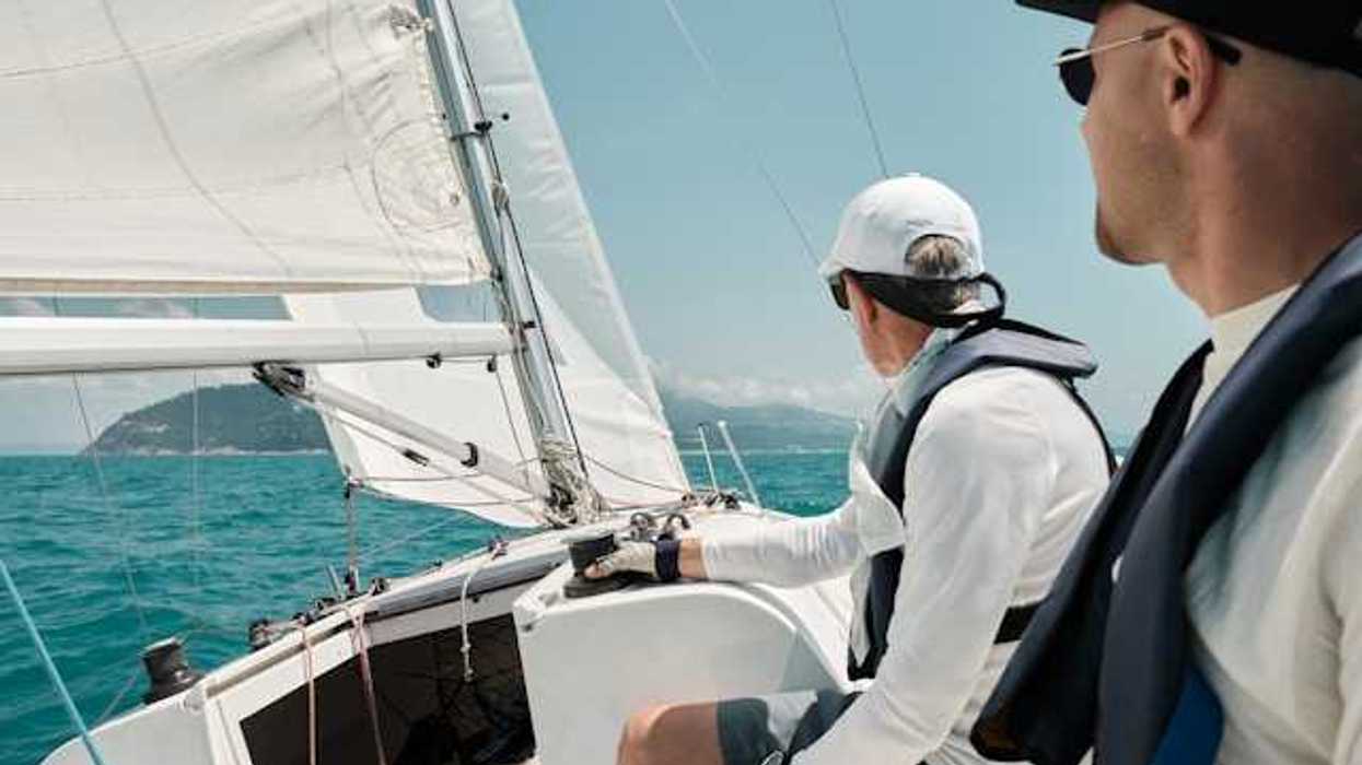 Two men on a sailboat