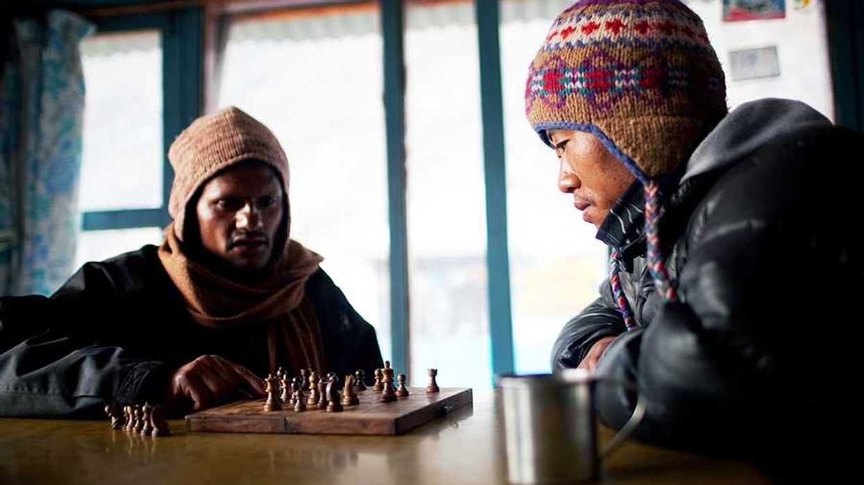 Two Nepalese porters playing chess