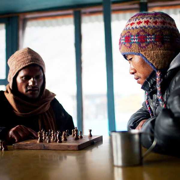 Two Nepalese porters playing chess