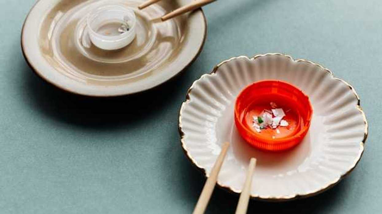 Two small dishes with plastic bottle caps and chopsticks
