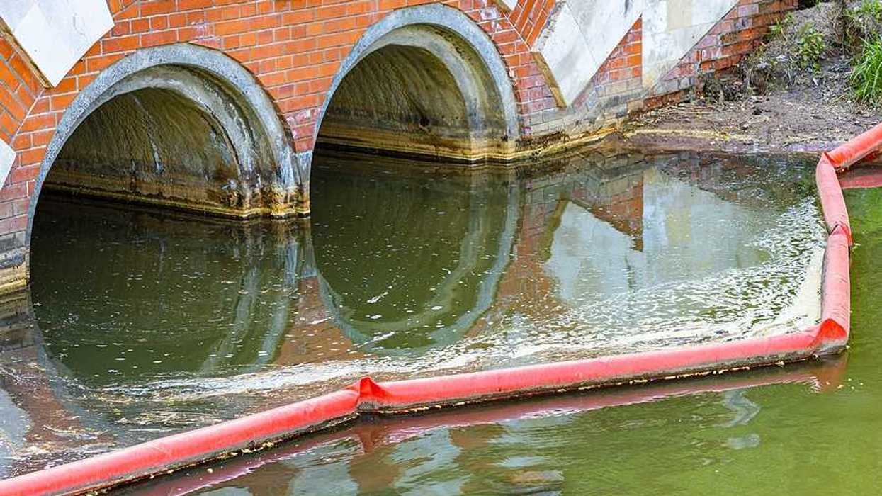 Two water pipes with green water coming out of them