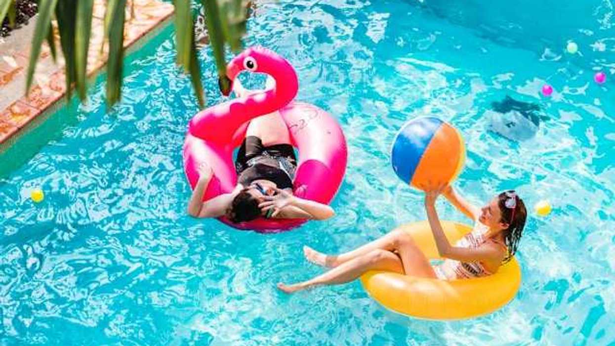 Two women floating in a pool