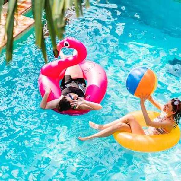 Two women floating in a pool