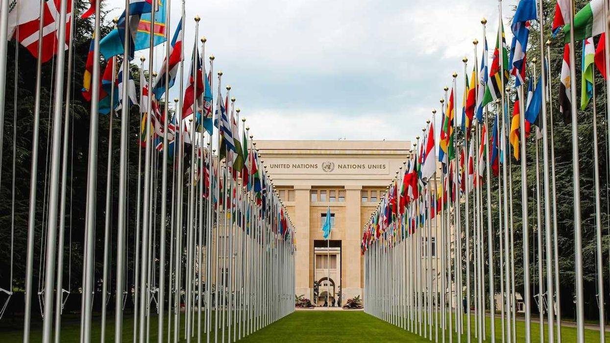 United Nations building with row of flags from member nations