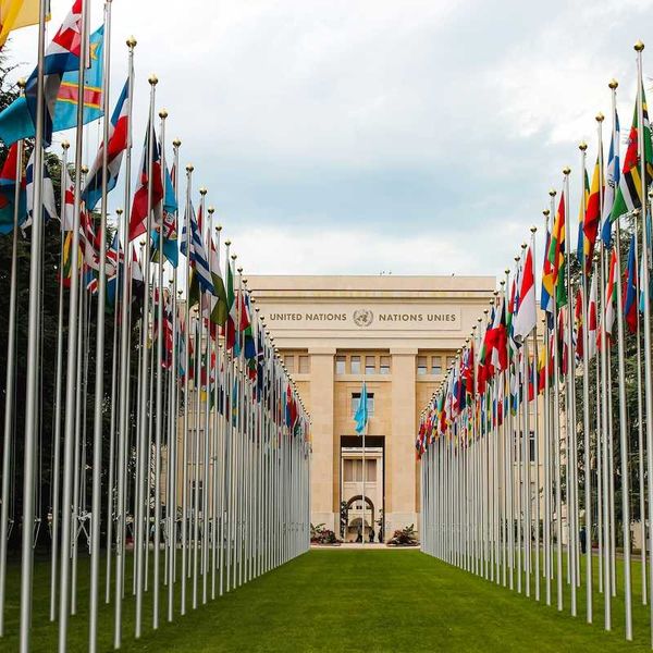 United Nations building with row of flags from member nations