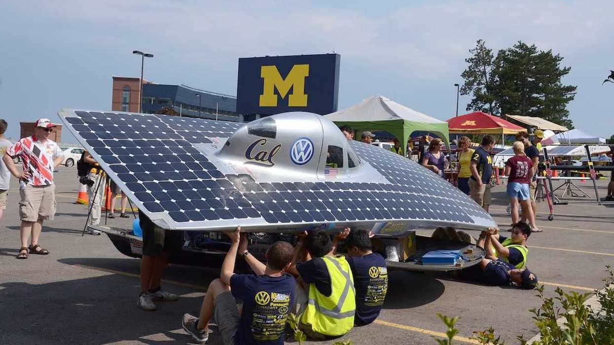 University of California Berkeley's solar car team members recharging their car at the American Solar Challenge stop July 16 2012 in Ann Arbor MI.