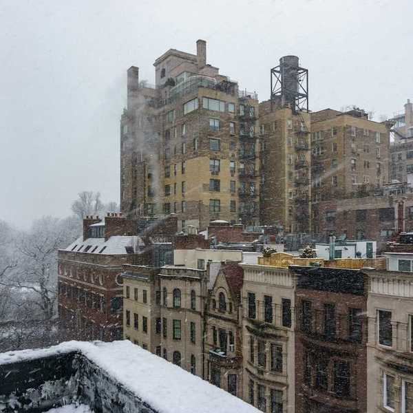 Urban winter scene; tenements at East 94th Street & Madison Avenue, New York, NY, USA