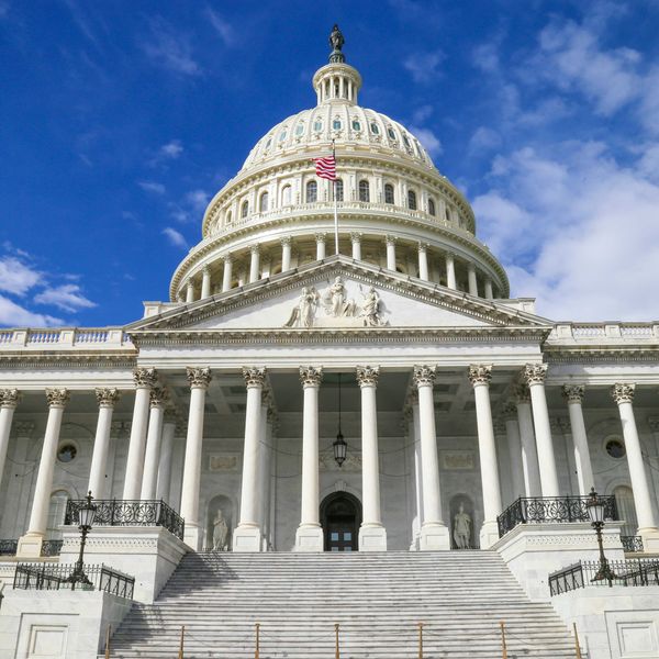 US capitol building against blue sky.