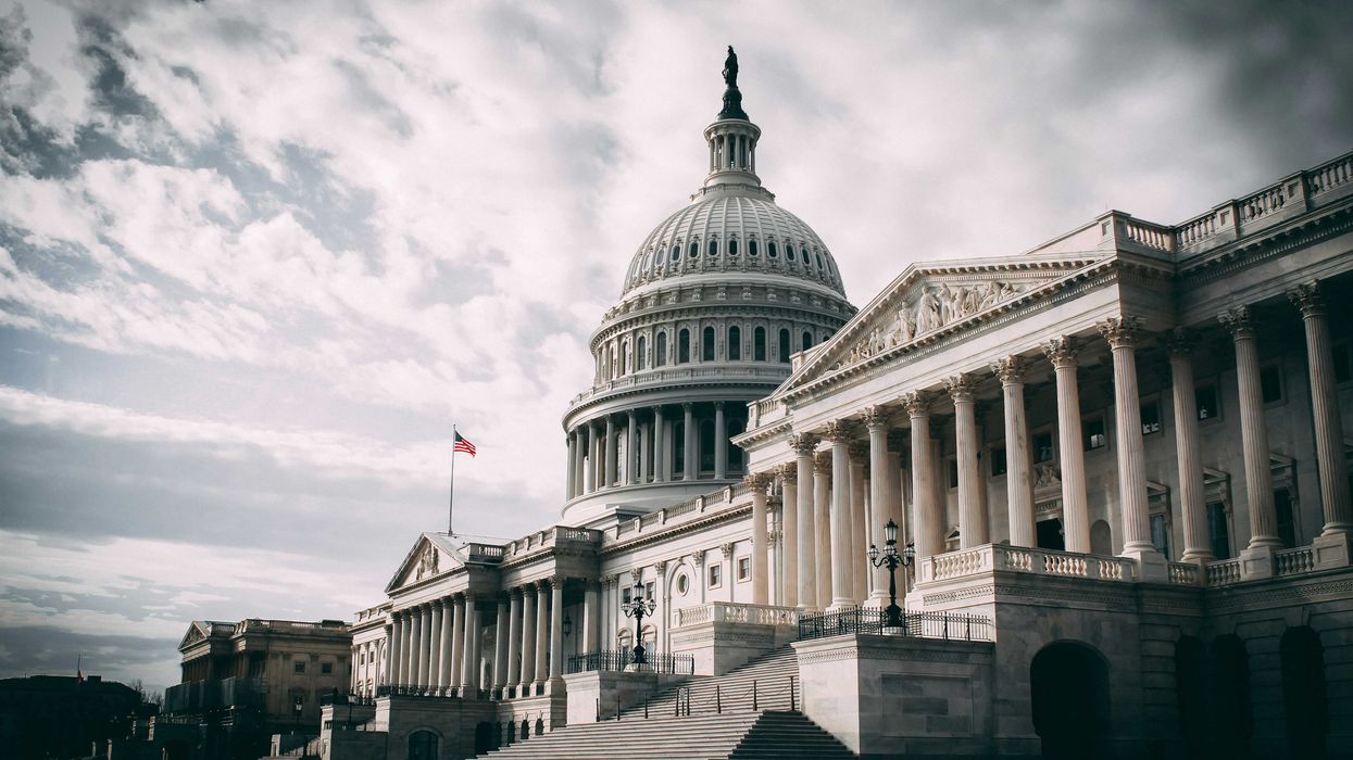 US Capitol under cloudy sky during daytime.