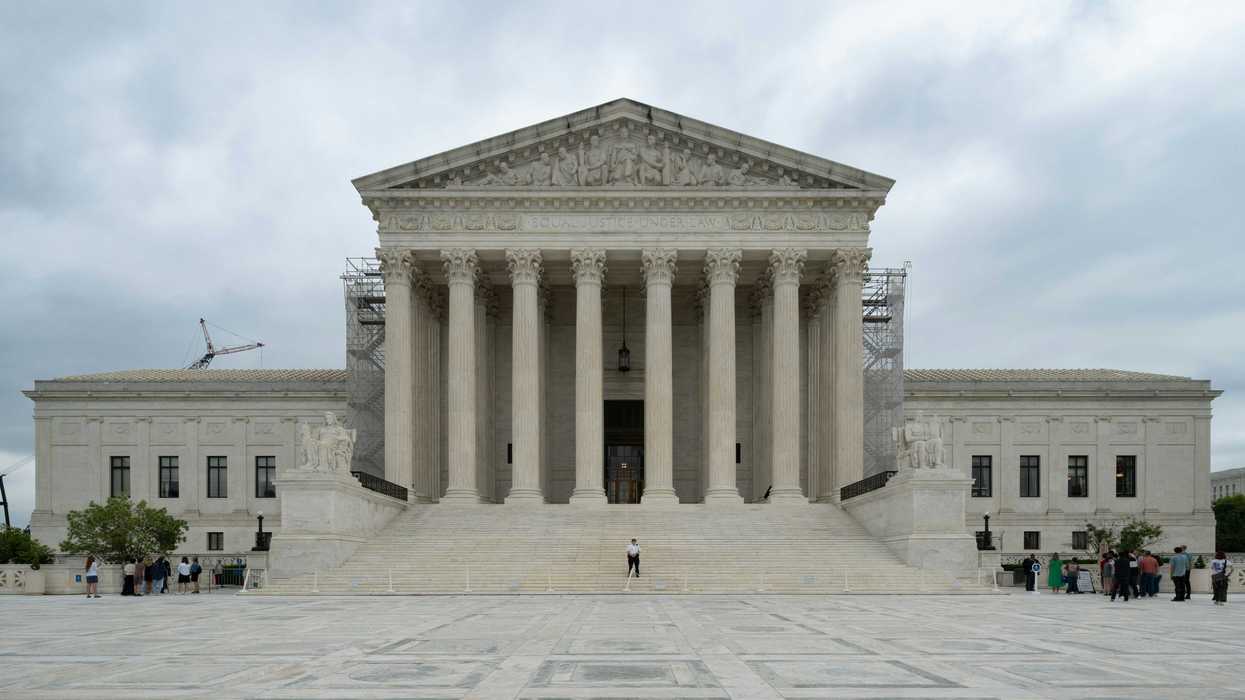 US Supreme Court with columns and pillars on a cloudy day.