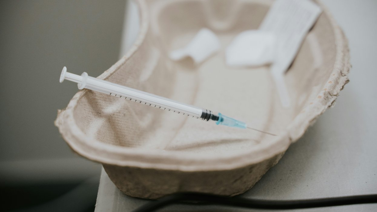 vaccine shot laying on a tray