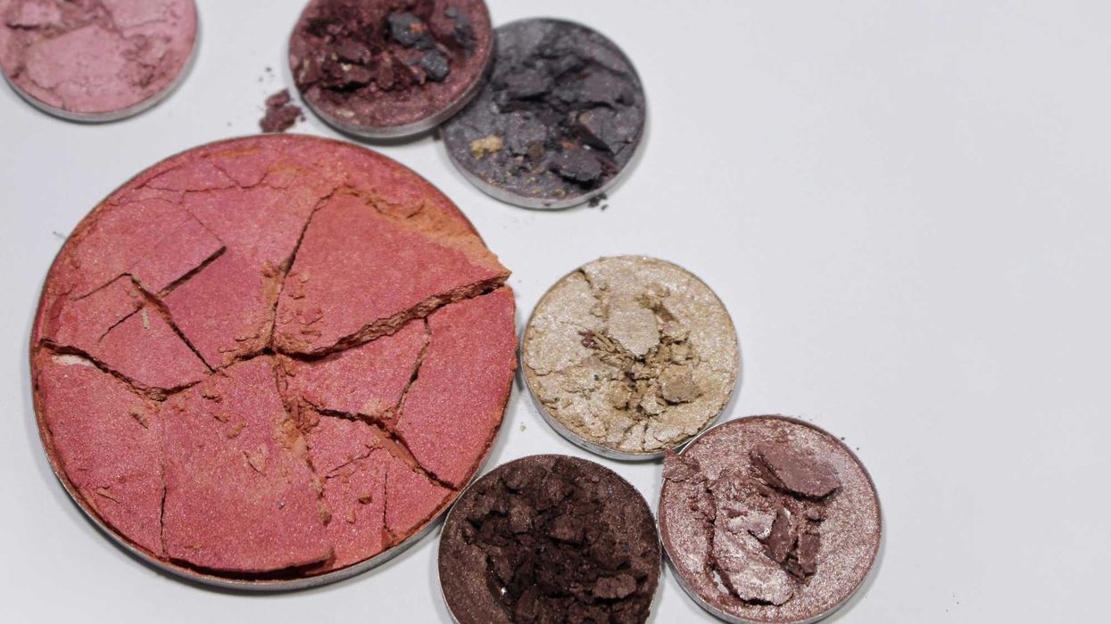 various powder cosmetics in different colors with lots of cracks and crumbles.