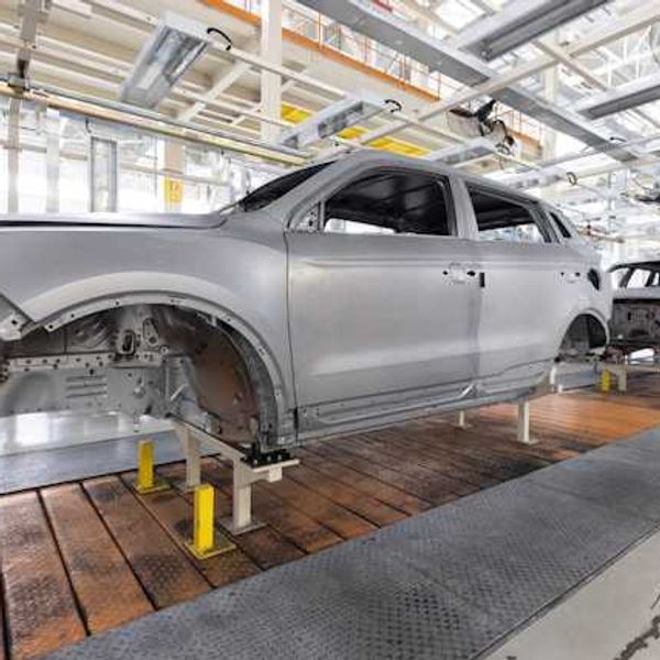 Vehicles in a production line in a manufacturing plant
