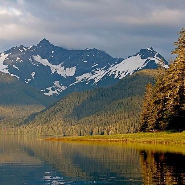 View of a lake with mountains in the background.