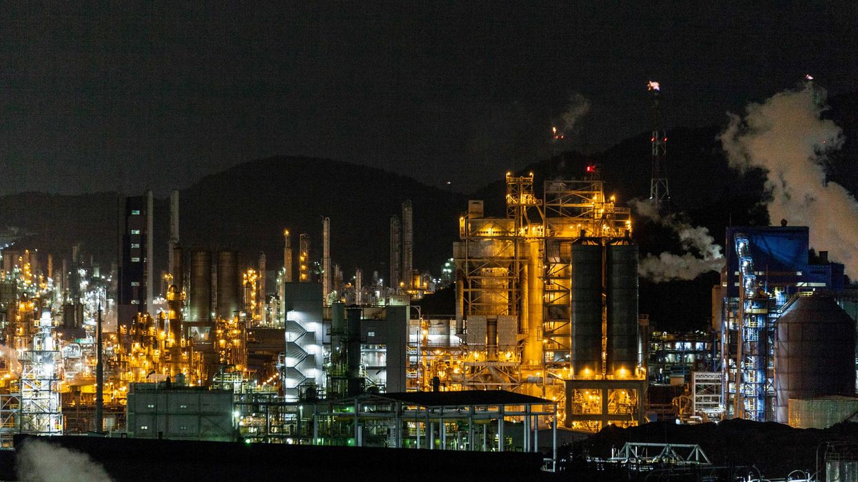 view of chemical plant during nighttime.