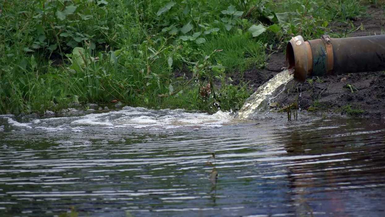 wastewater discharging into a waterway from pipe