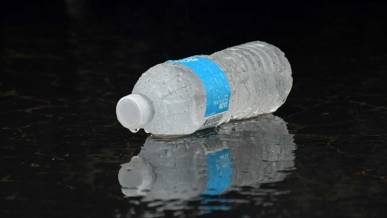 water plastic bottle on a black surface