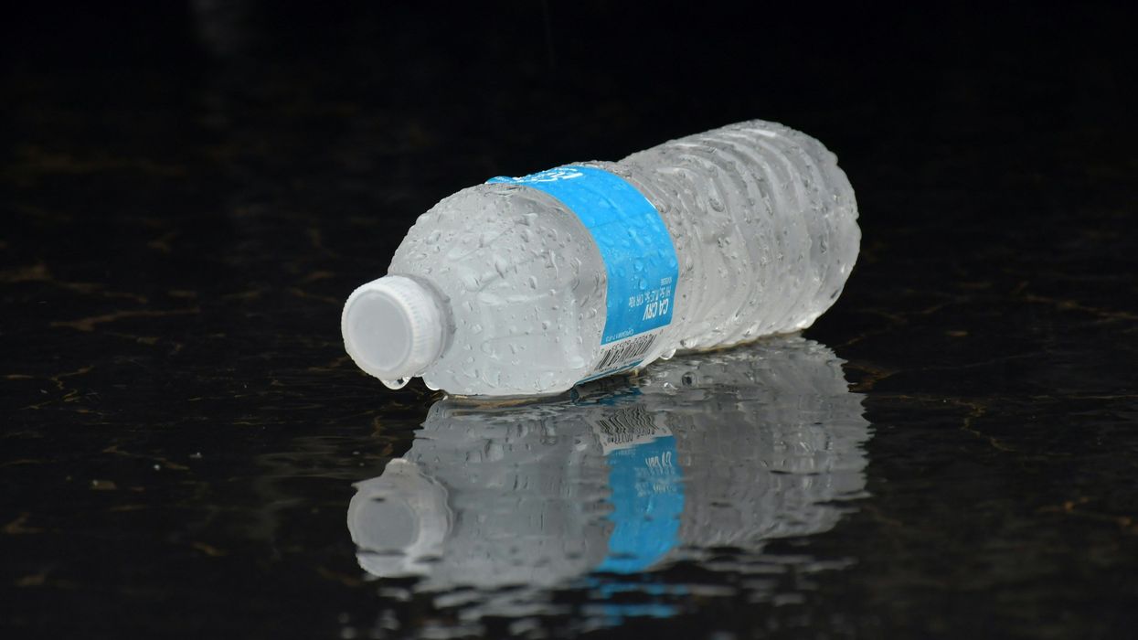 water plastic bottle on a black surface