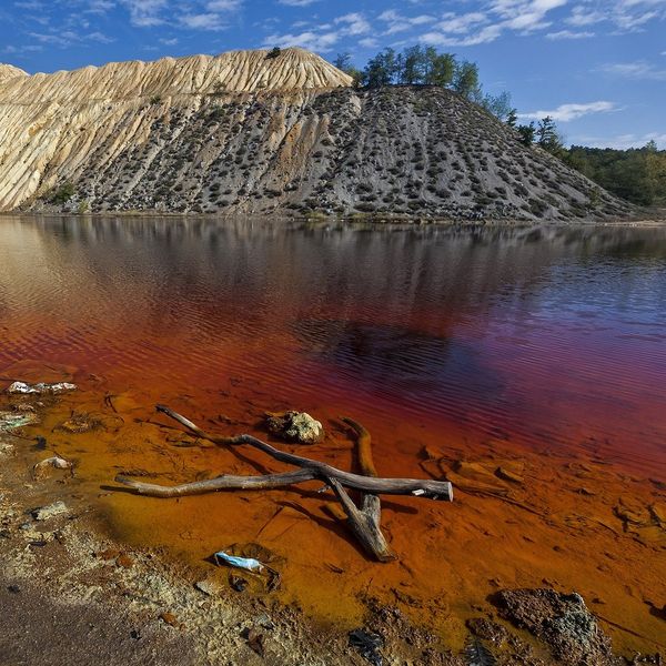 Water pollution from mine tailings contamination.