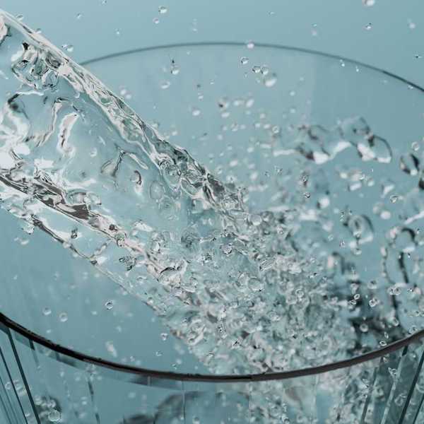 Water pouring into water glass