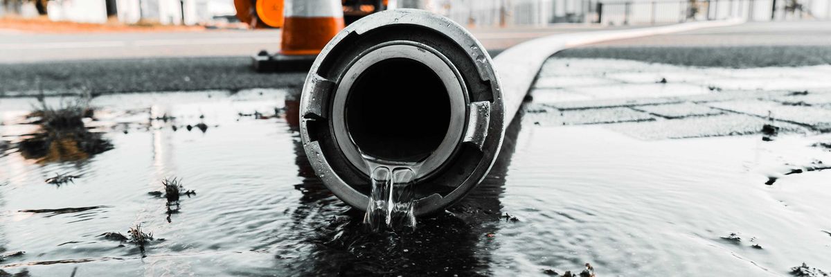 Water spills out of a plastic pipe