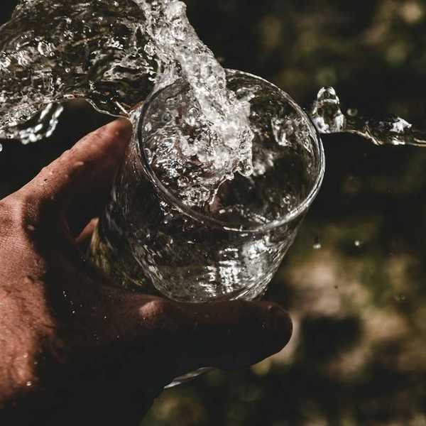 Water splashing into a glass