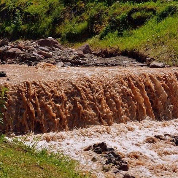waterfall with brown water