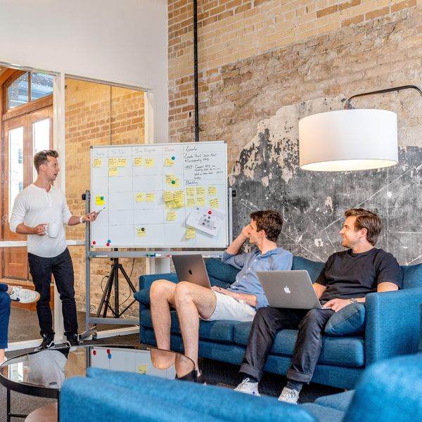 white men meeting chart office