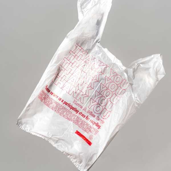 white plastic bag against grey background.