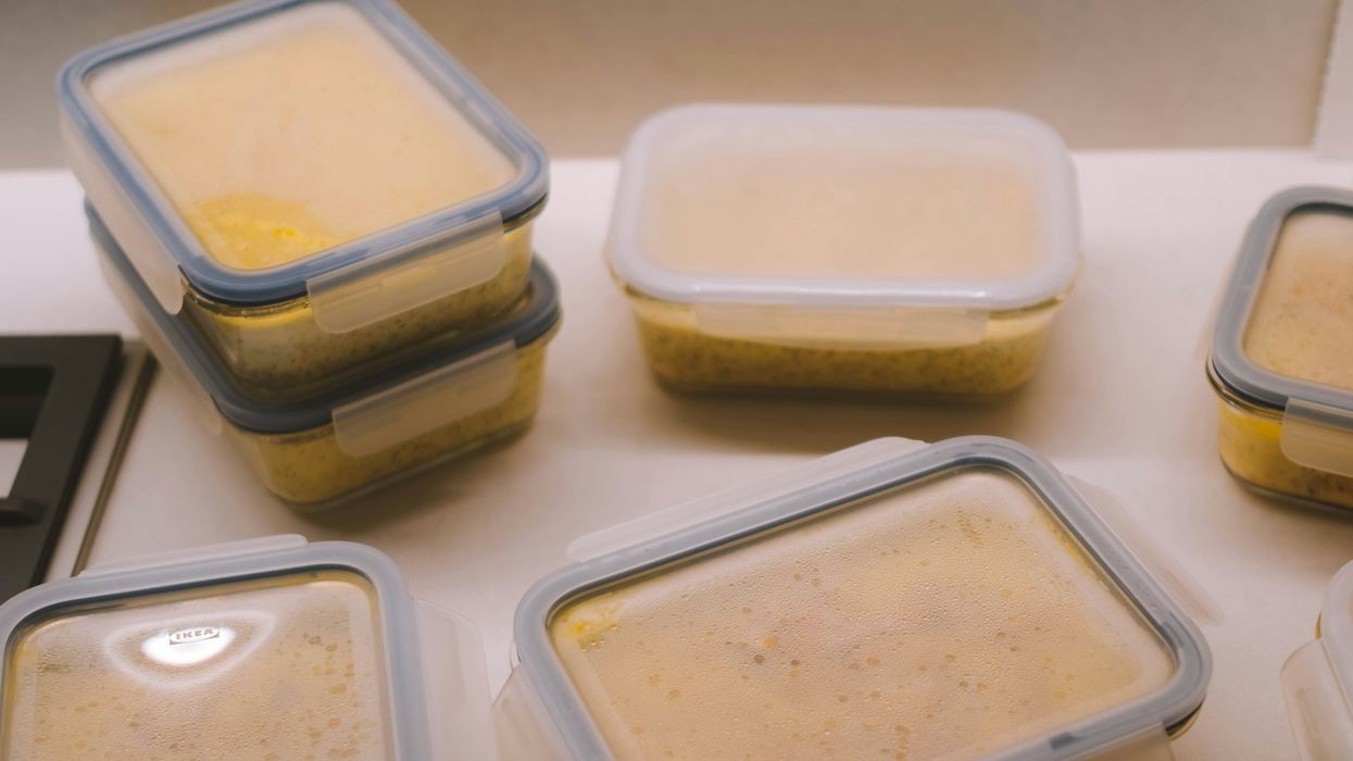 white plastic food container on white table