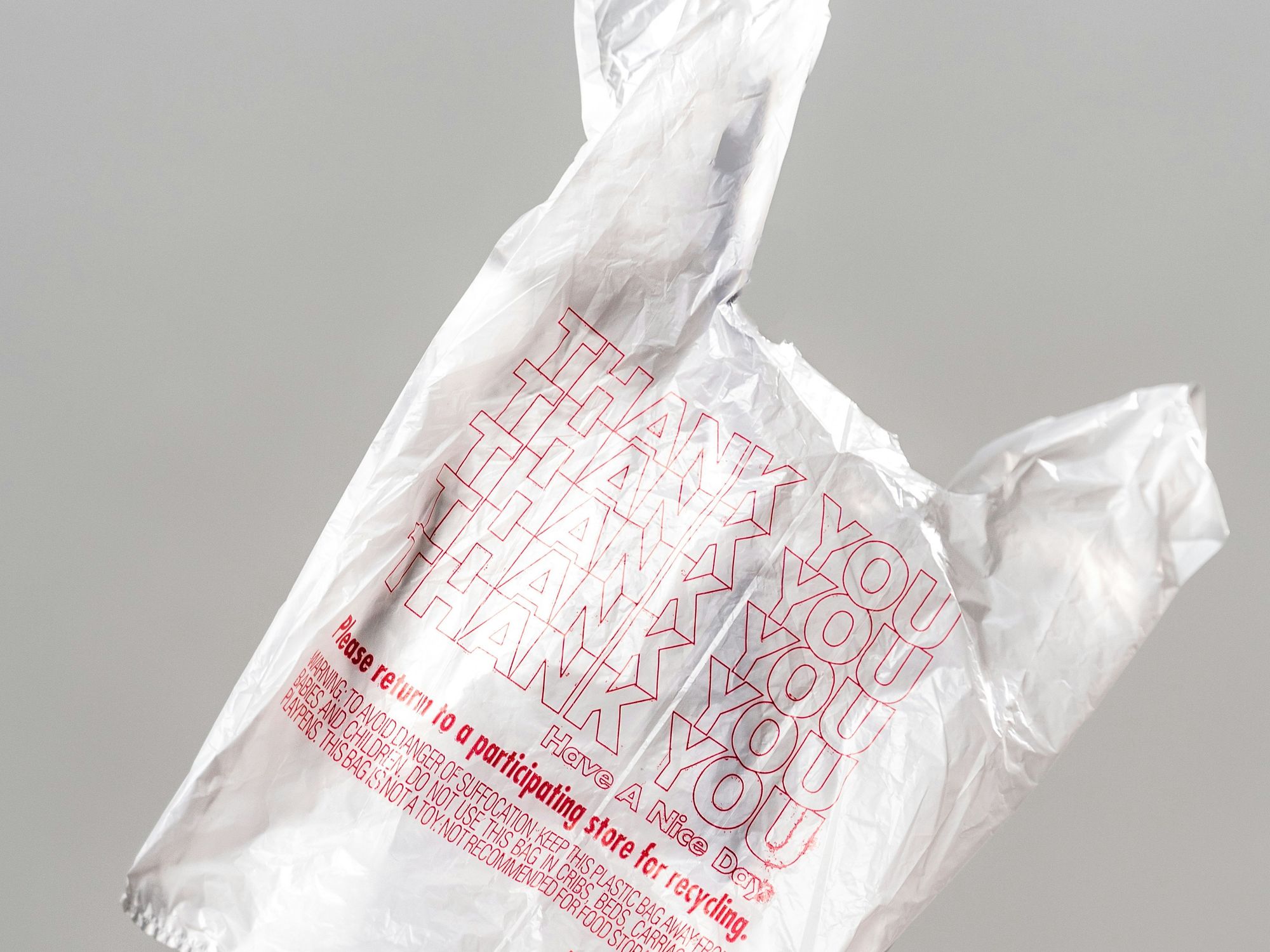 white plastic shopping bag on white table.