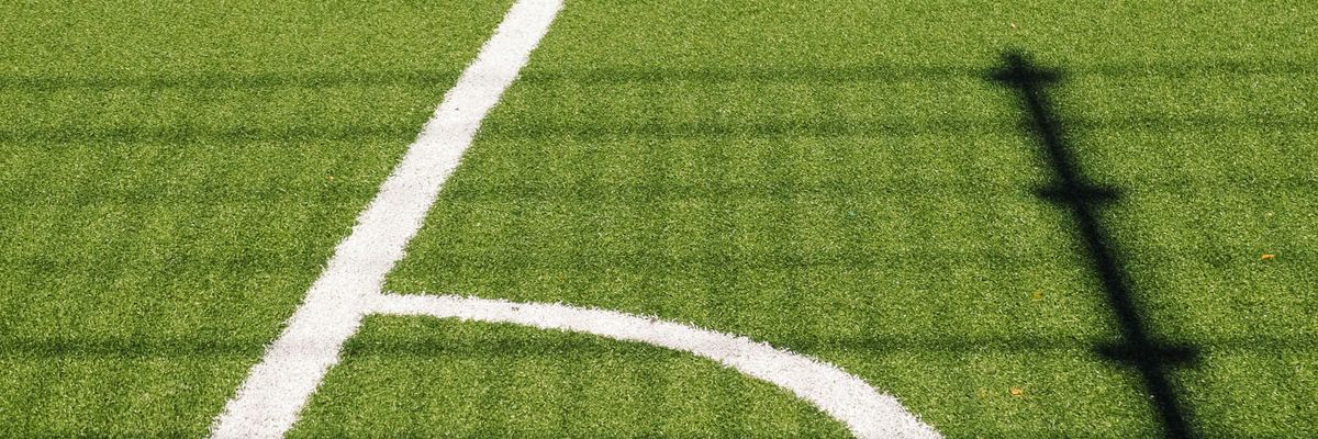 white sports lined turf