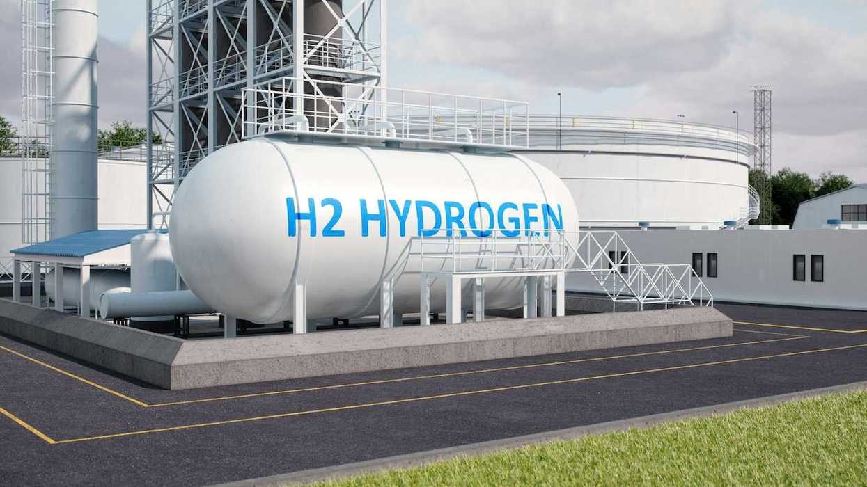 White storage tank lettered "H2 HYDROGEN" in blue letters
