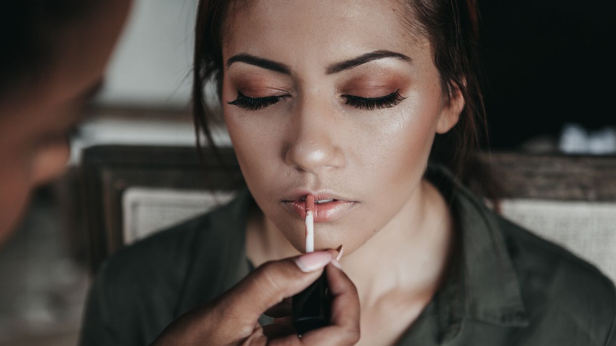 woman applying makeup