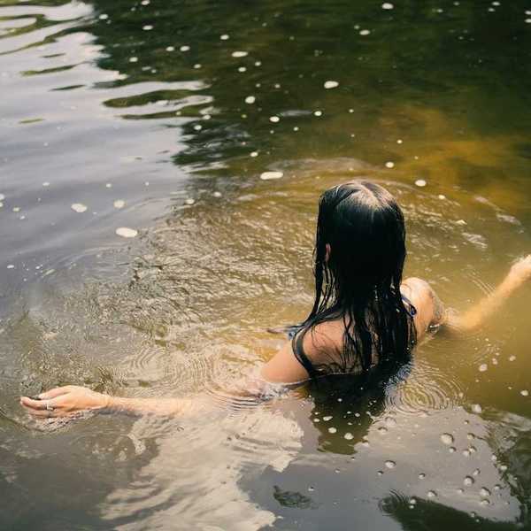 Woman bathing in a river