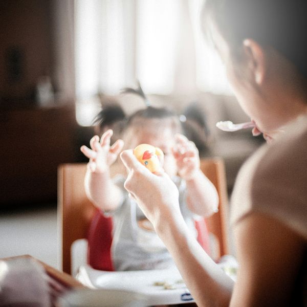 woman feeding baby