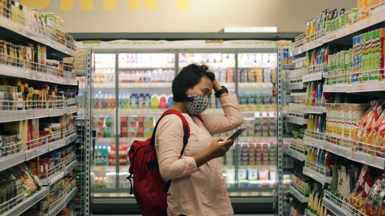 woman in supermarket shelf