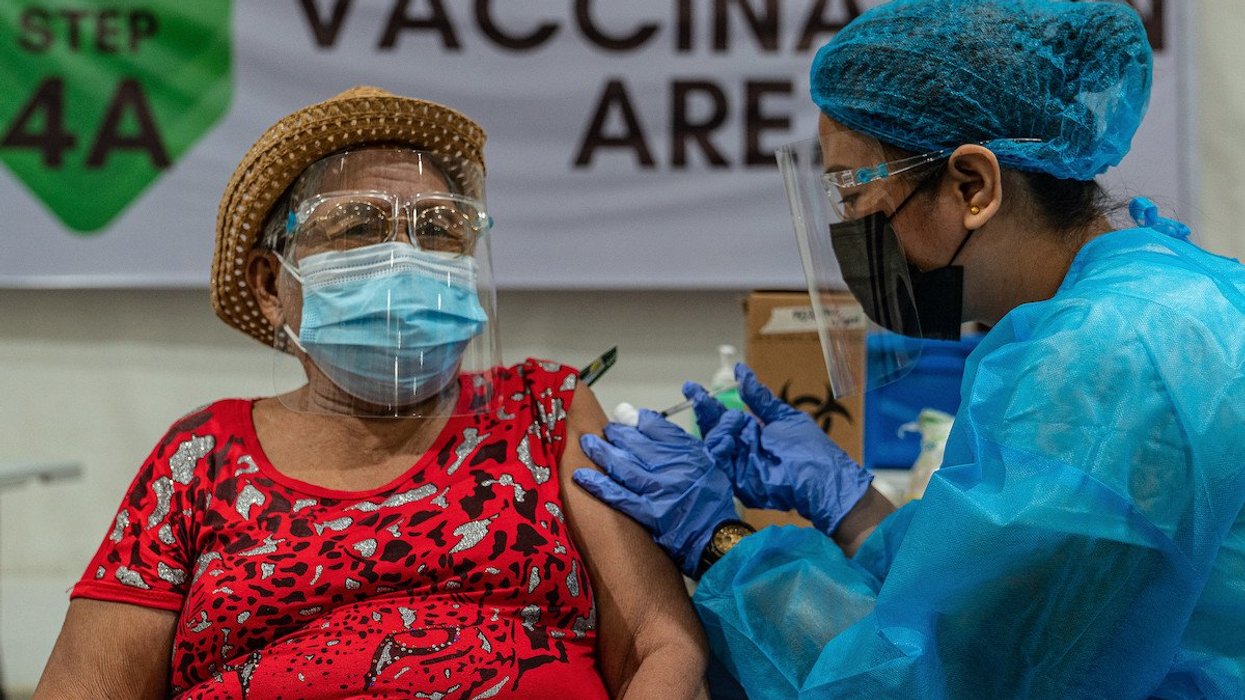woman receiving vaccine shot