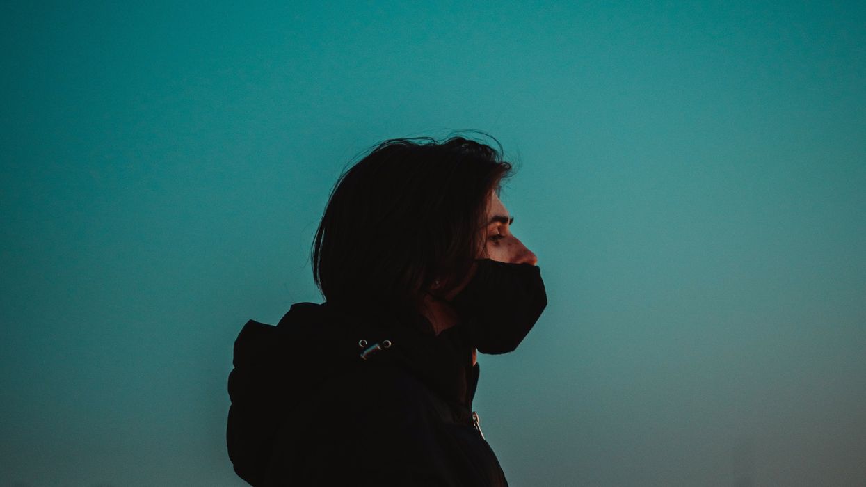 woman wearing mask at night